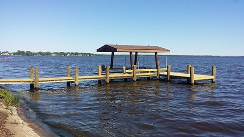 A boat lift has been installed next to the dock.