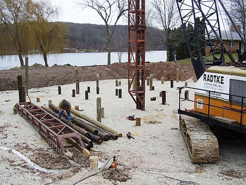 A radtke construction vehicle is parked in the dirt