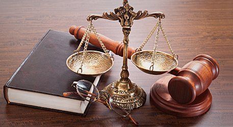 Legal book, justice scale and gavel