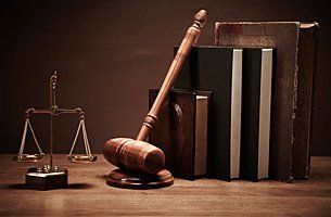 Justice scale, gavel and legal books
