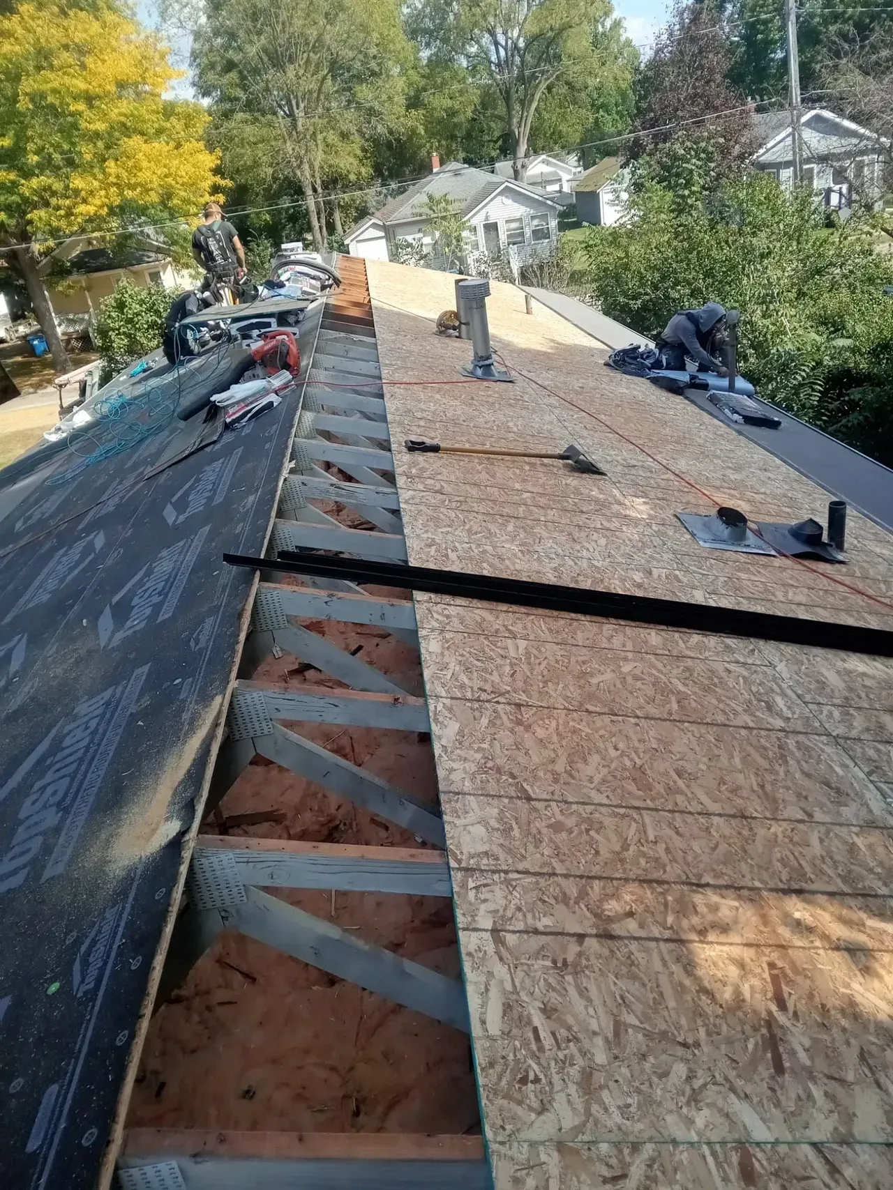 A roof is being built on top of a house.