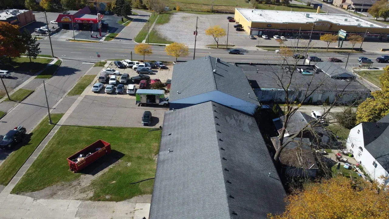 An aerial view of a roof of a building in a city