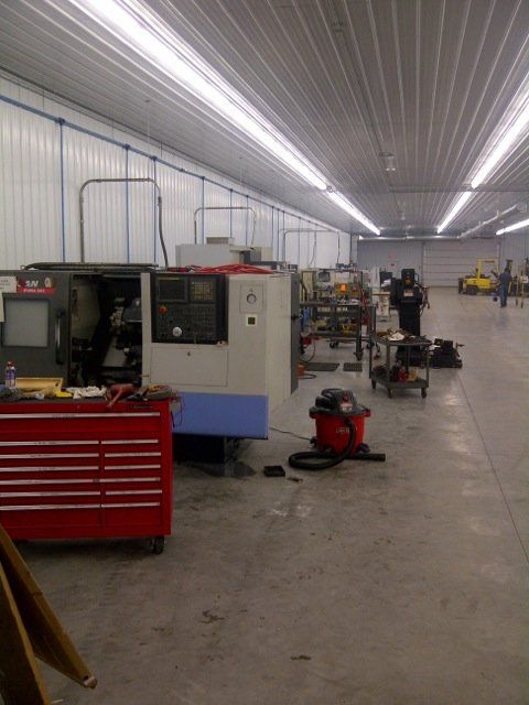 A warehouse with a machine that has the letter a on it