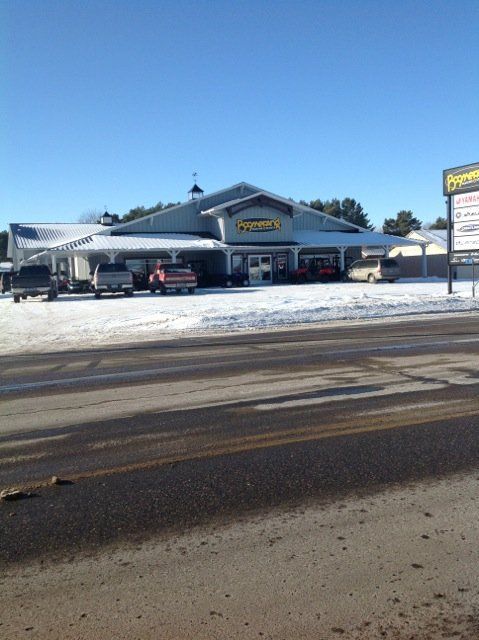 A store front with a yellow sign that says ' frontier ' on it