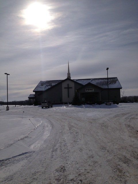A church with a cross on the front of it