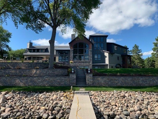 A large house with a dock in front of it