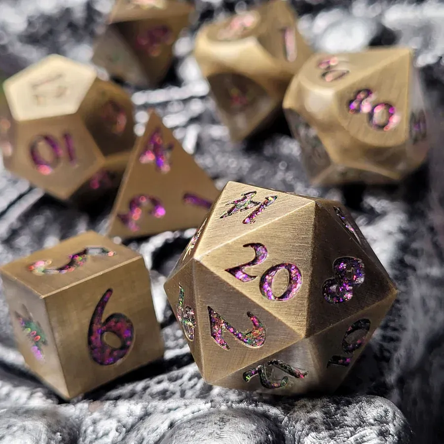 Set of bronze dice with purple numbering, resting on a textured gray surface.