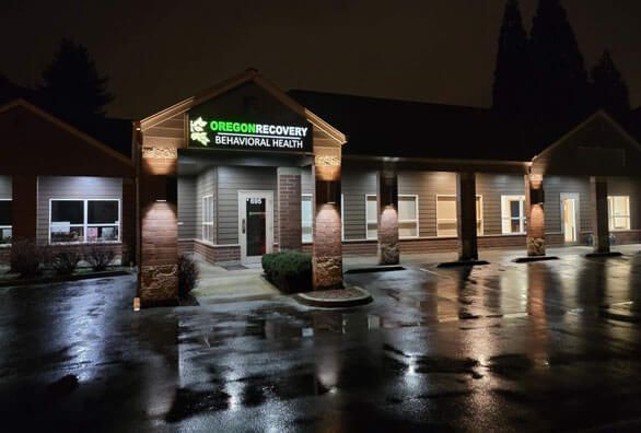 a building with a sign that says ' oregon recovery physical therapy ' on it
