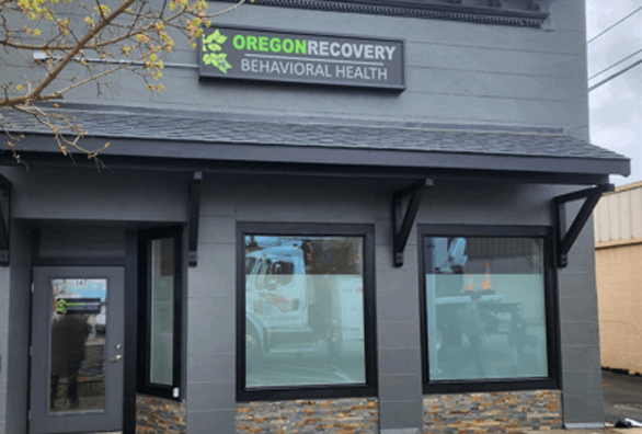 A building with a sign that says oregon recovery behavioral health