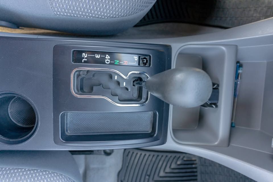 A close up of a shifter in a car.
