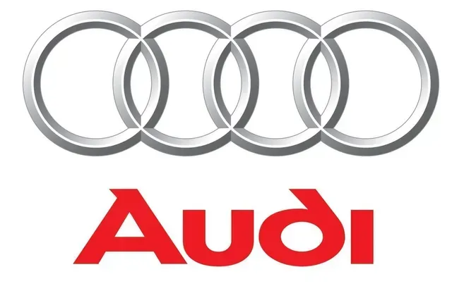 Audi logo with four silver rings above red “Audi” text on a white background