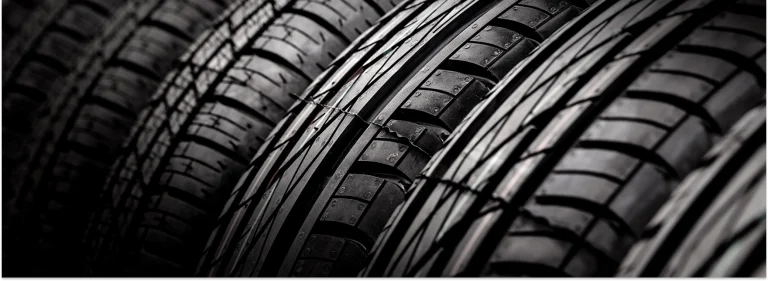 Close-up of stacked tire treads in black and white