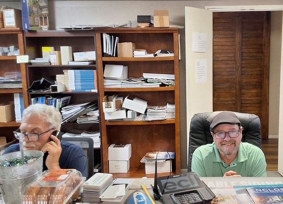 Ray and Curt behind counter