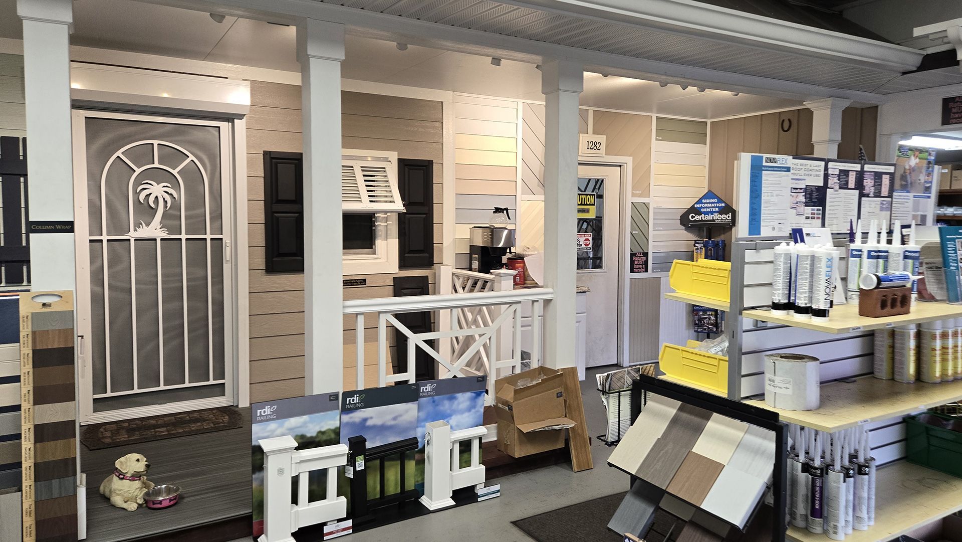 Hardware store interior with white shelves, doors, tools, and paint supplies on display