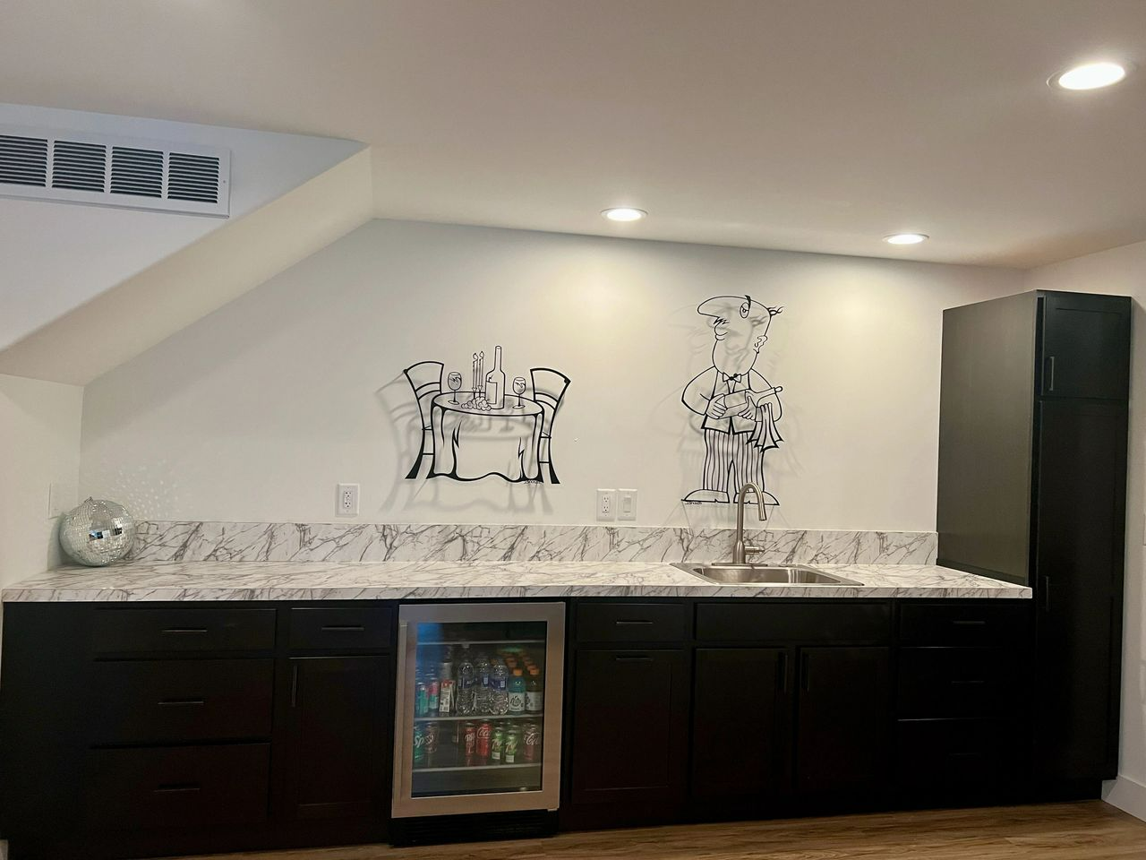 a kitchen with a refrigerator and a sink