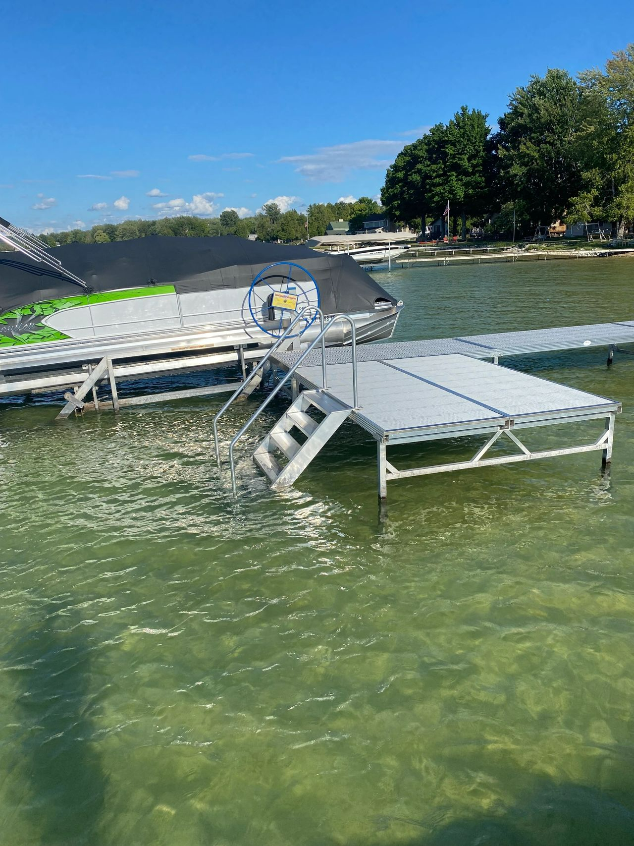 a boat is sitting on top of a dock in the water