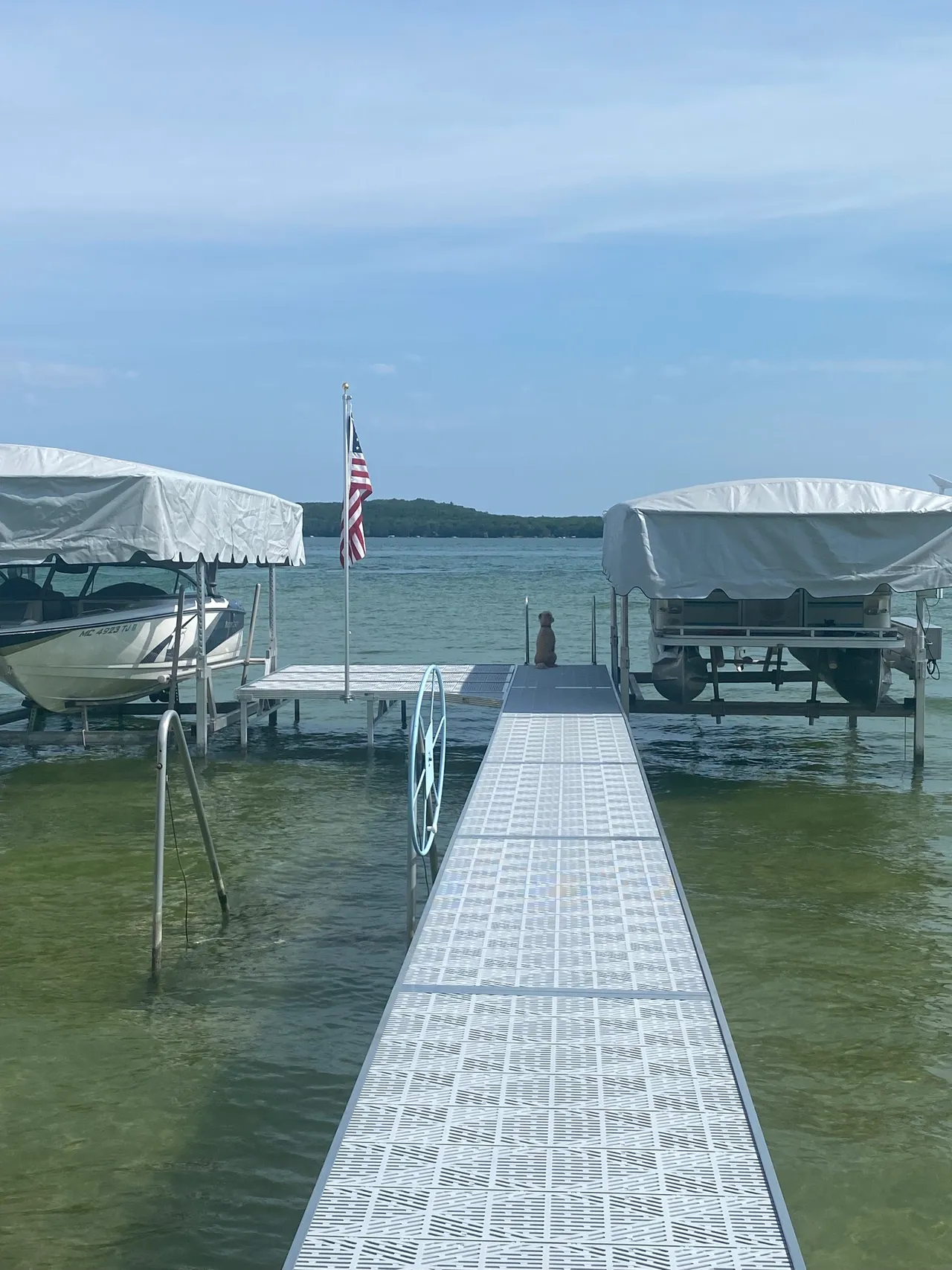 a boat is docked at a dock on a lake