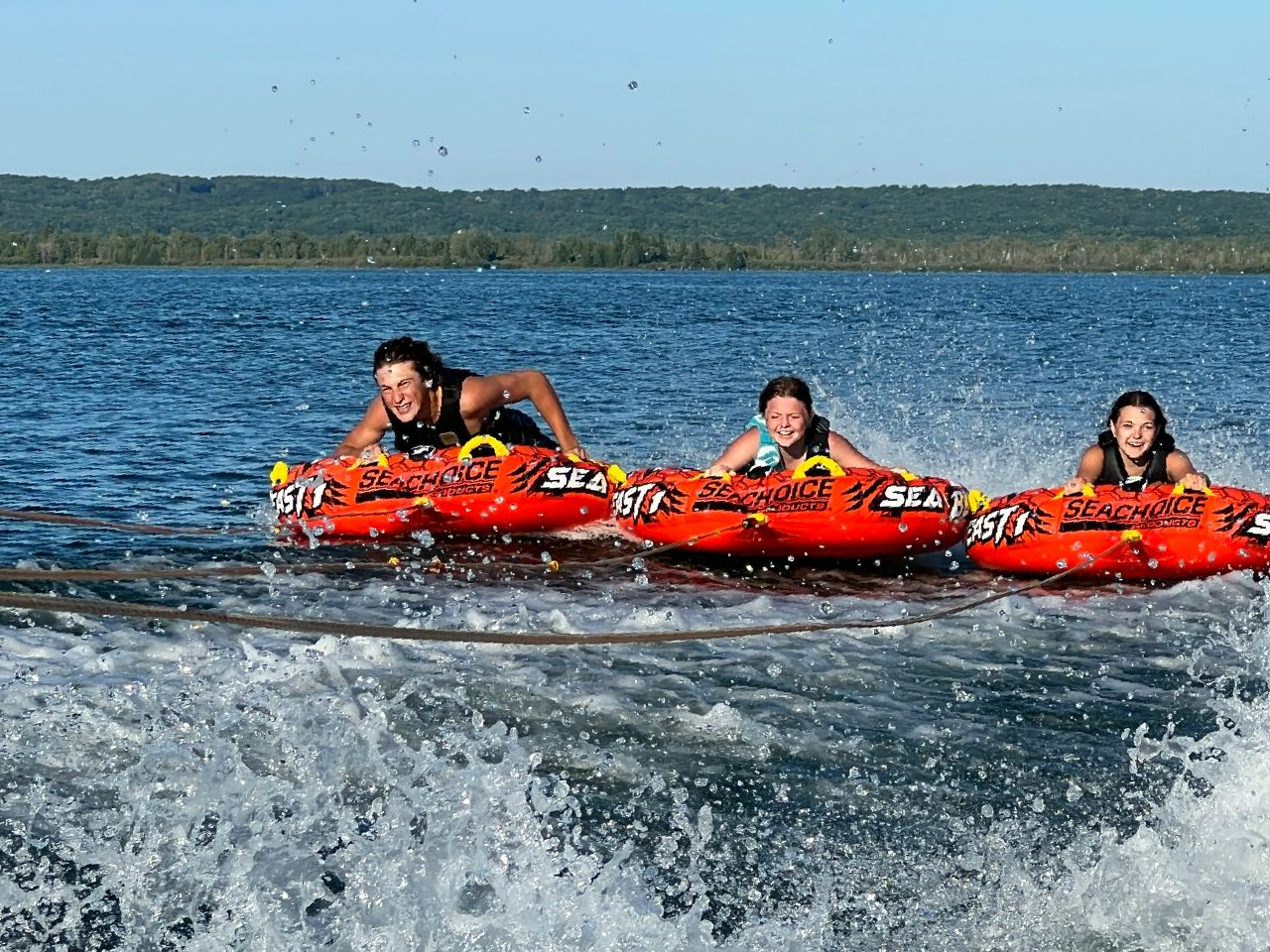 a group of people enjoying water sports