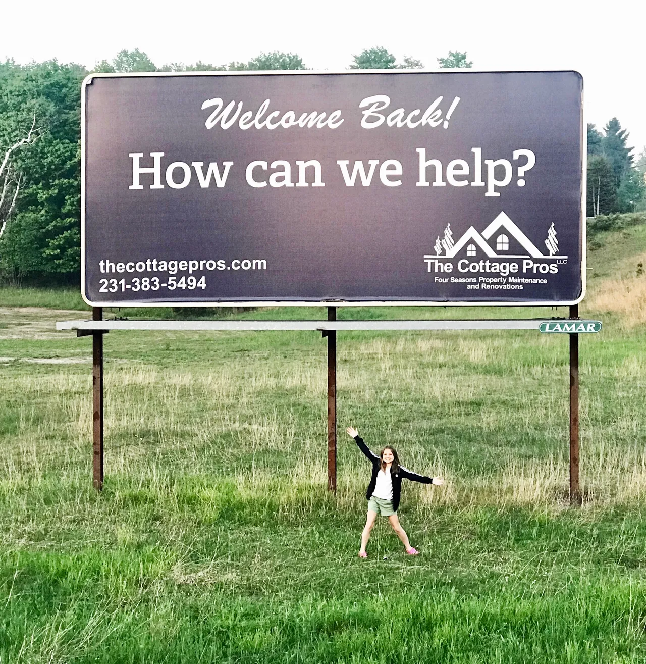 a billboard that says welcome back how can we help