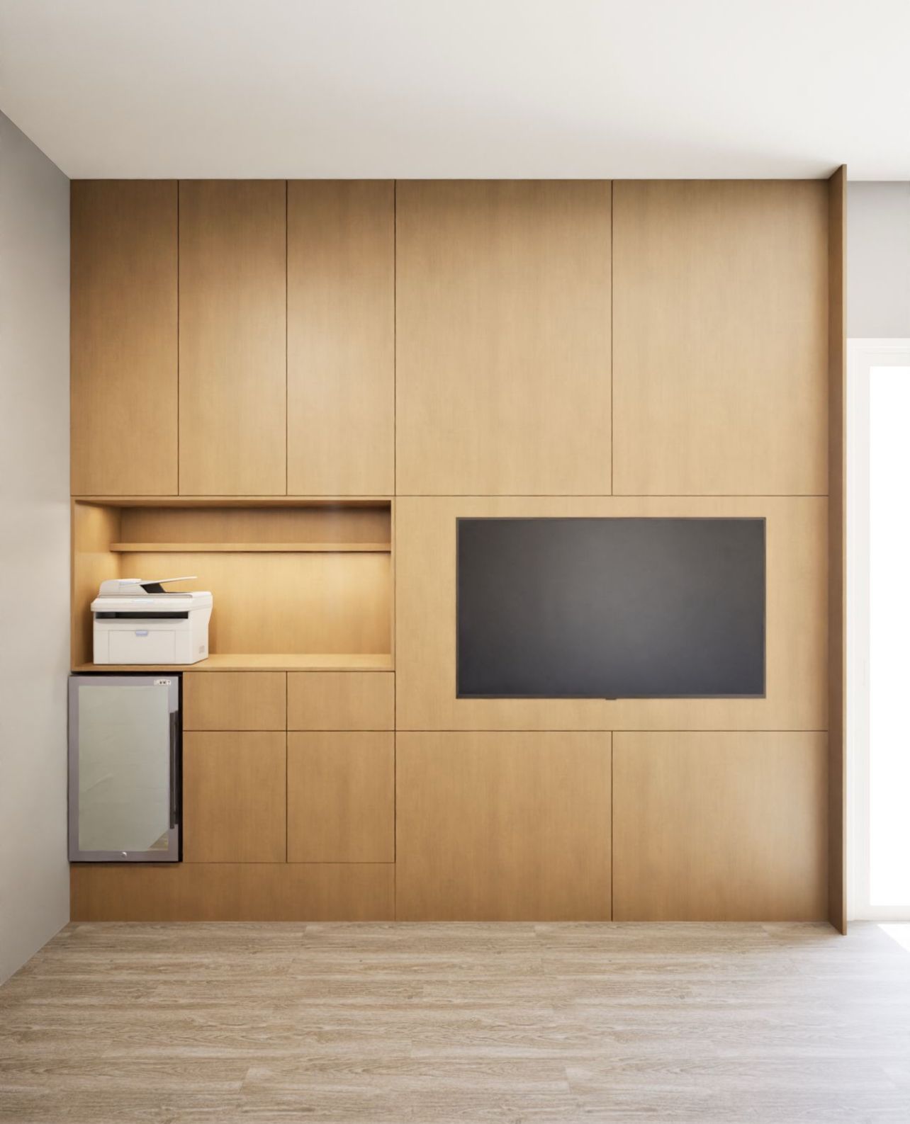 A light wood custom wall unit with a built-in television, printer shelf, and a small glass-fronted mini fridge.