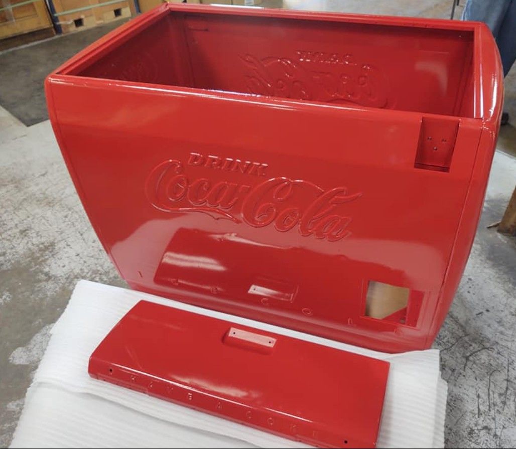 A red cooler with the lid open