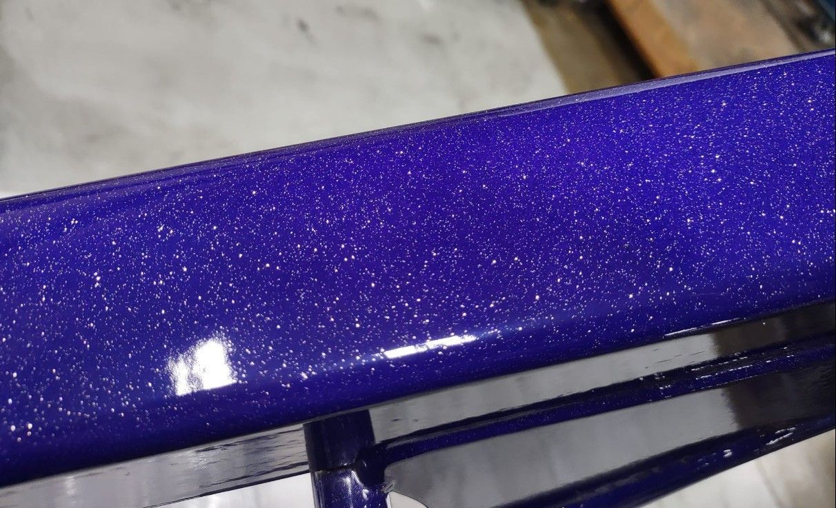 A close up of a purple object with glitter on it