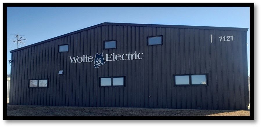A black building with the word electric on it