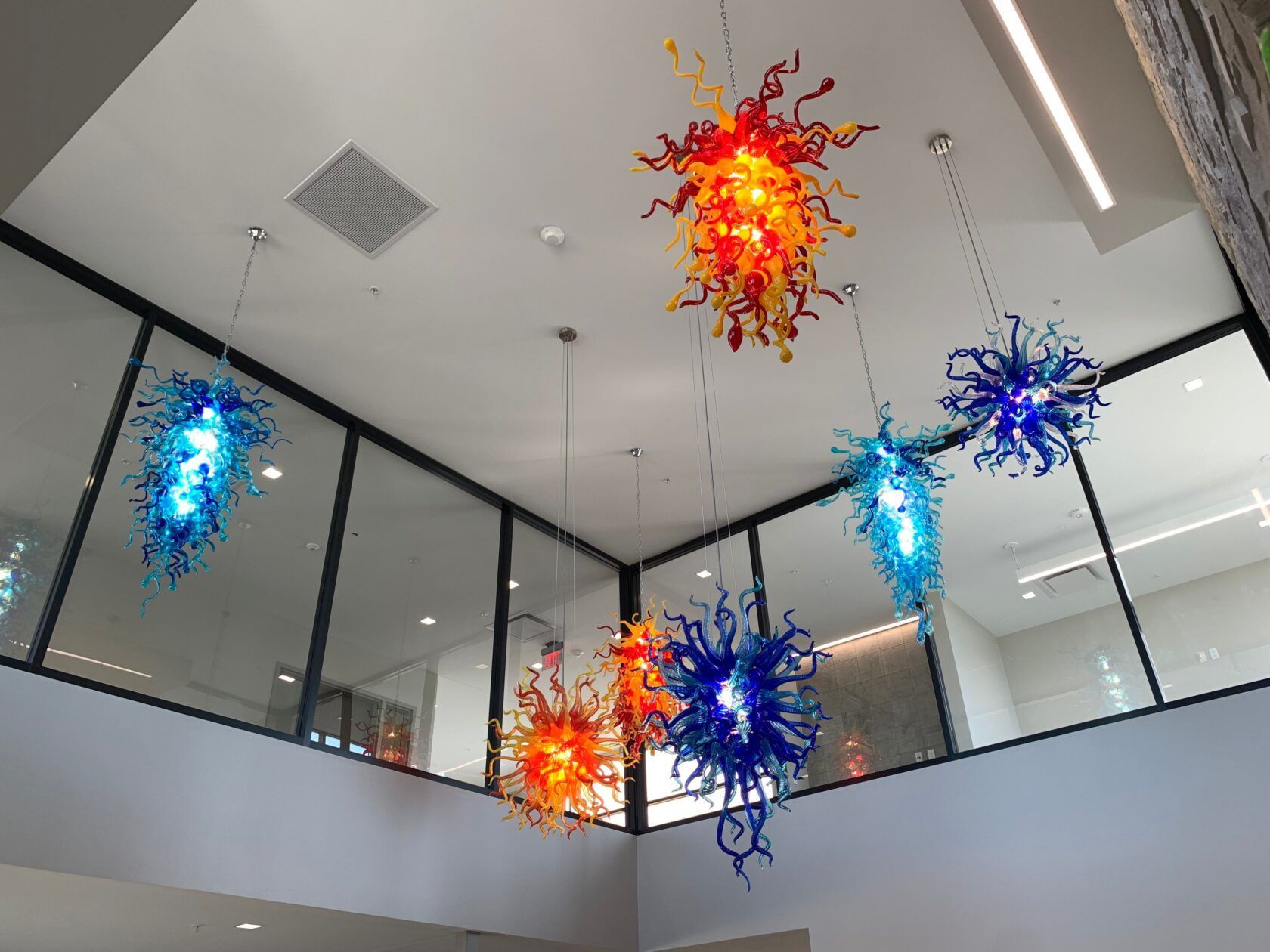 A ceiling with a lot of colorful lights hanging from it
