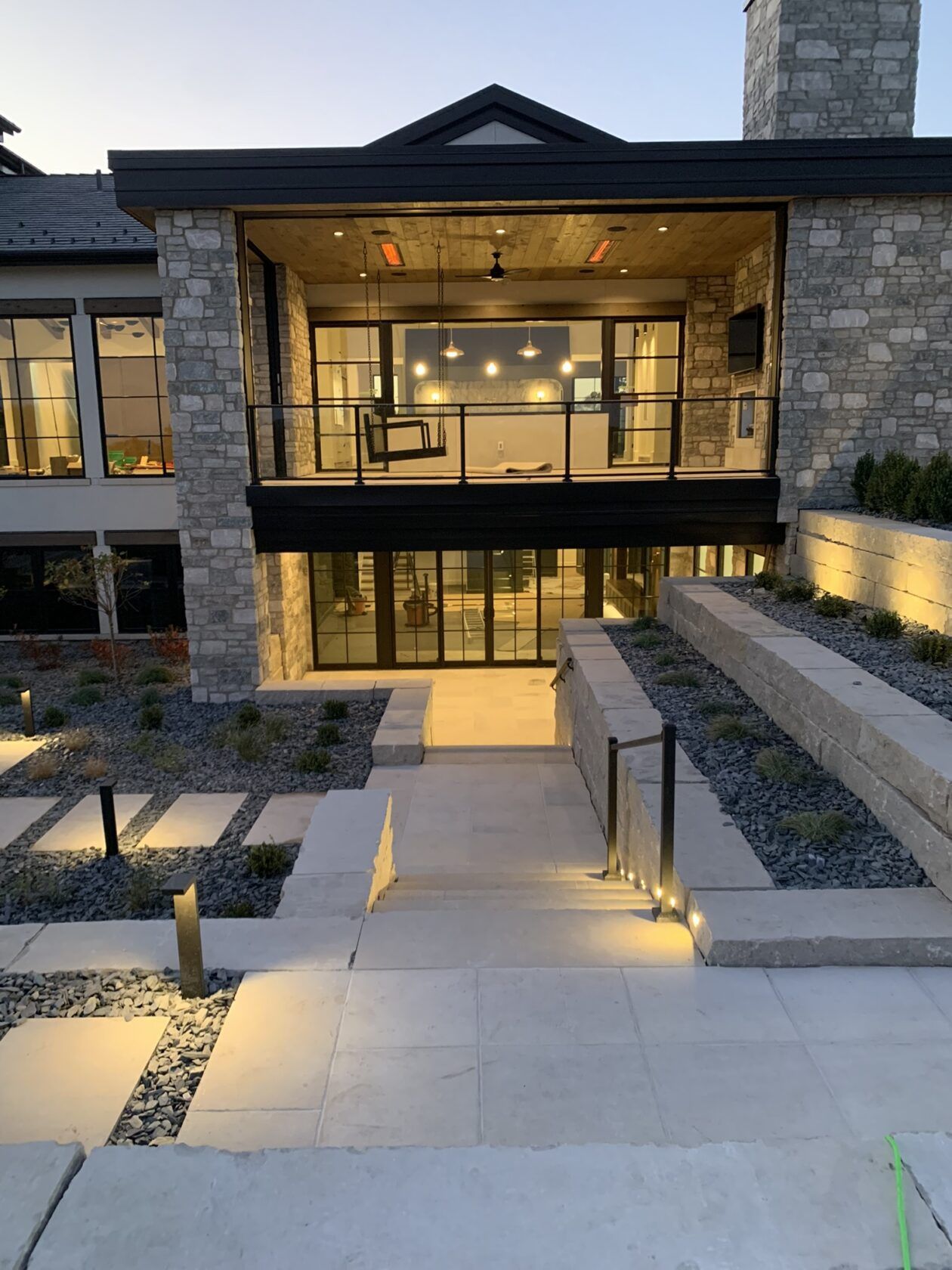 A large house with a lot of windows and stairs leading up to it