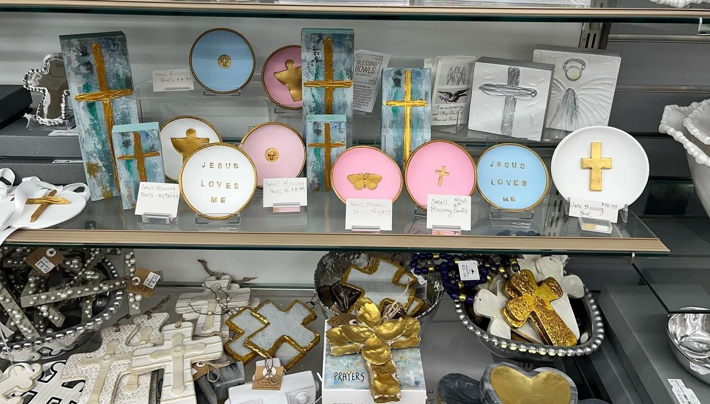 A display case filled with a variety of religious items.