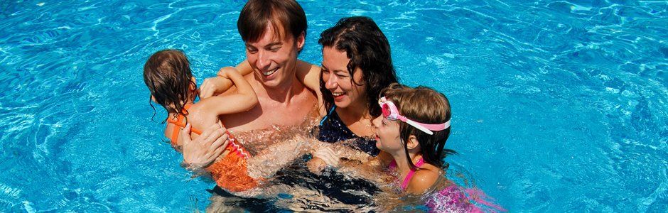 Happy family on the pool