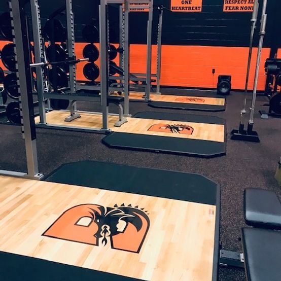 A gym with a sign that says one heartbeat