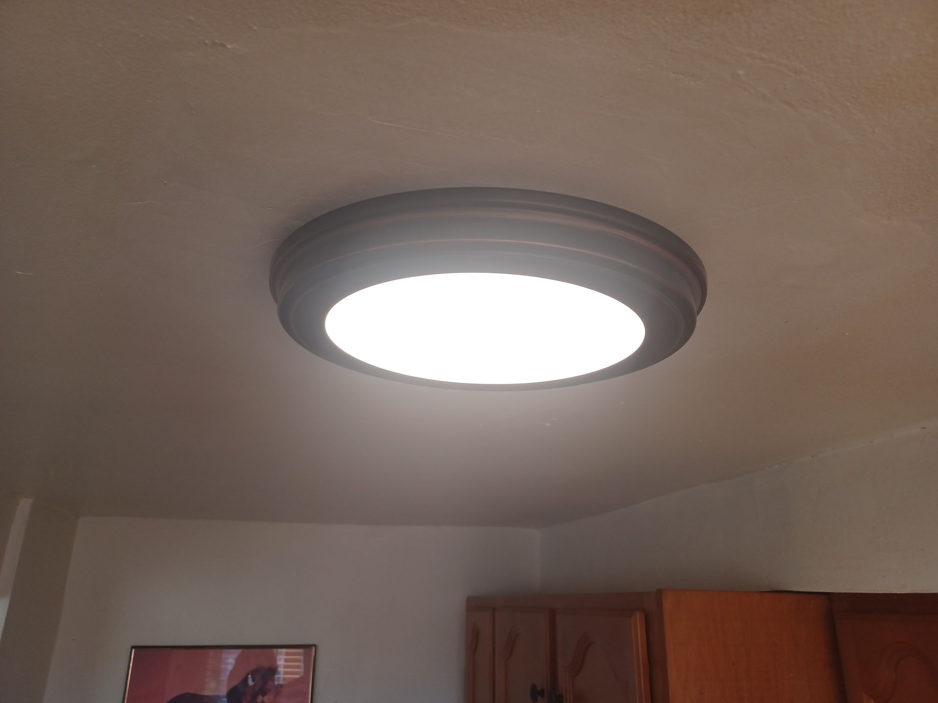 A ceiling light is shining brightly in a room