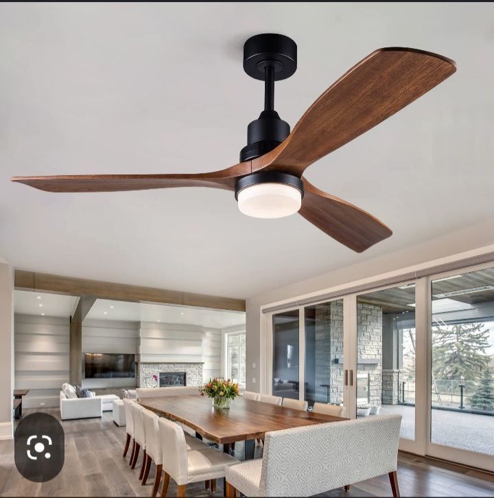 A ceiling fan is hanging from the ceiling in a living room
