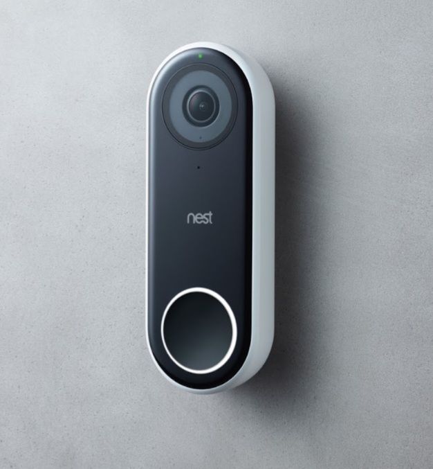 A nest doorbell is mounted on a gray wall