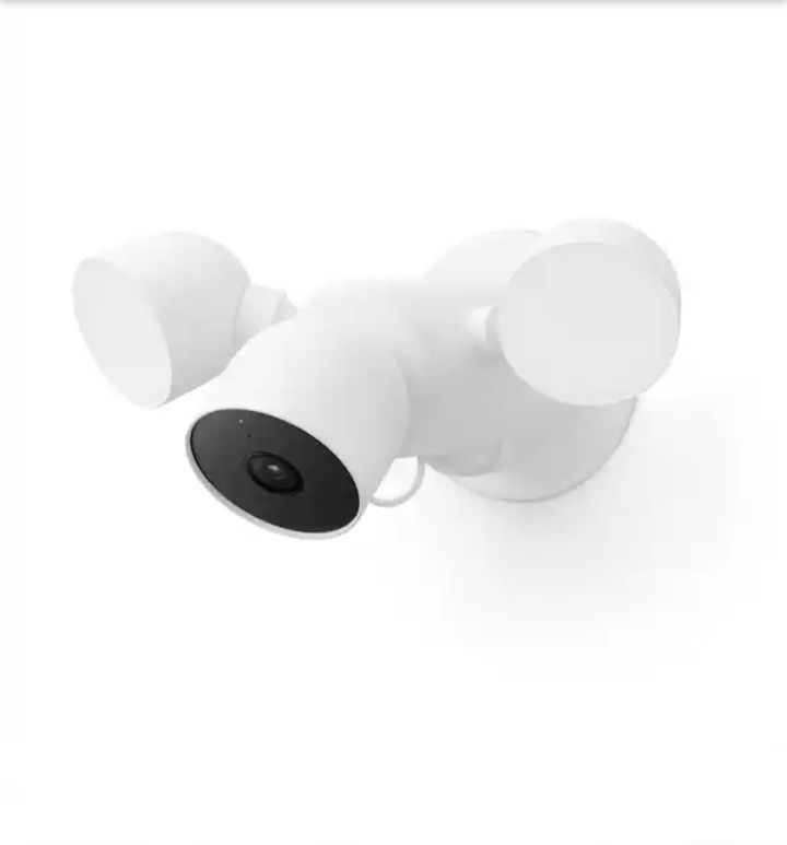 White three-head security camera with black lens on a plain background