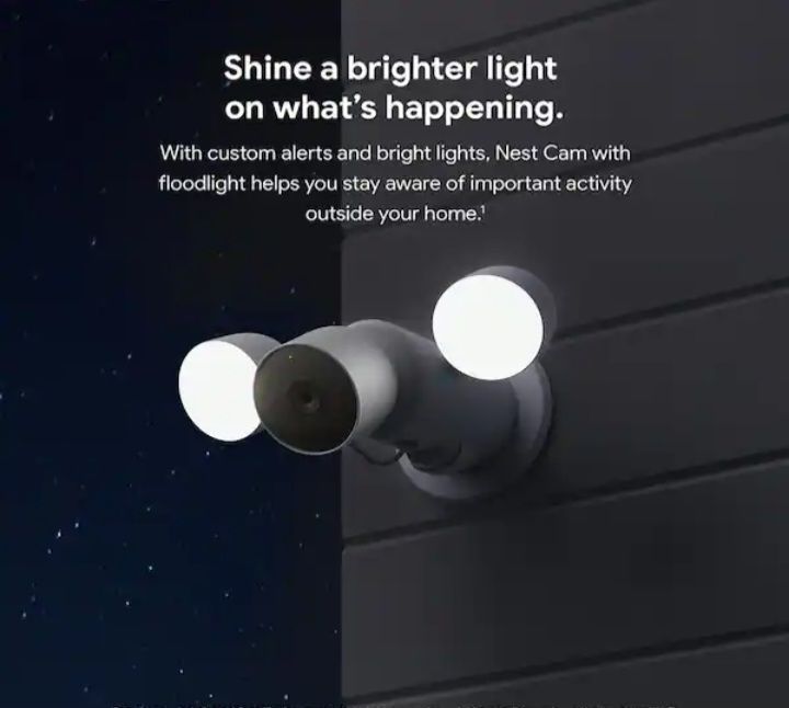 Outdoor Nest Cam with two bright floodlights on a dark house exterior, promoting brighter alerts and activity awareness