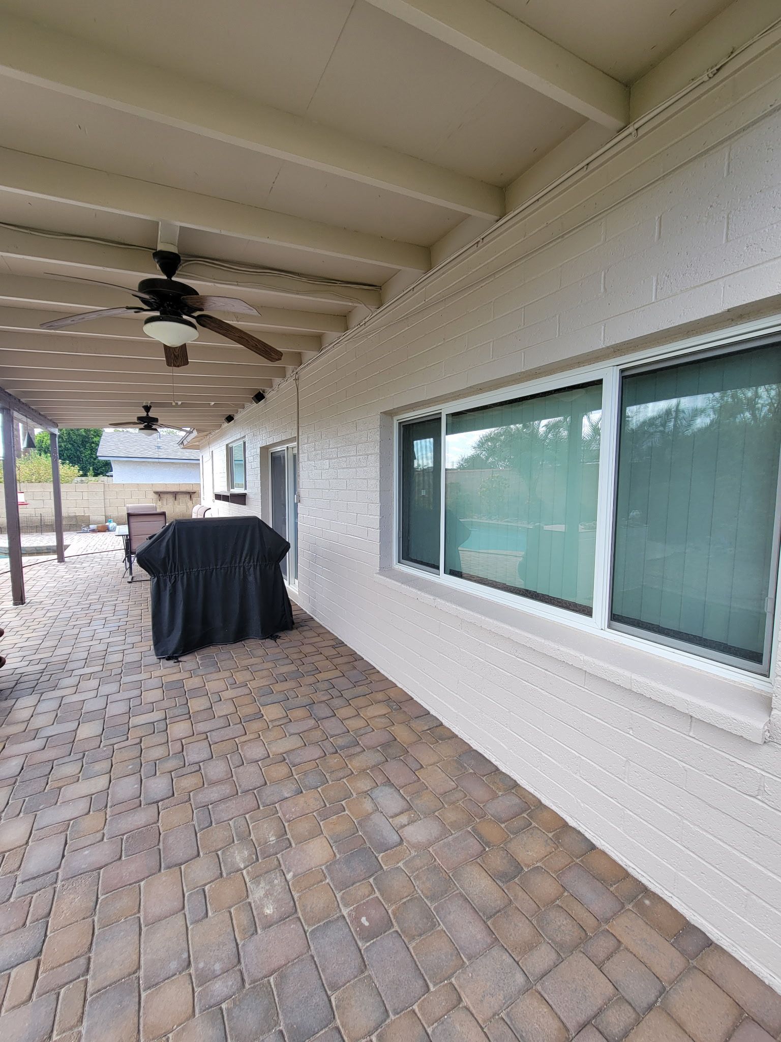 There is a large window on the side of the house.