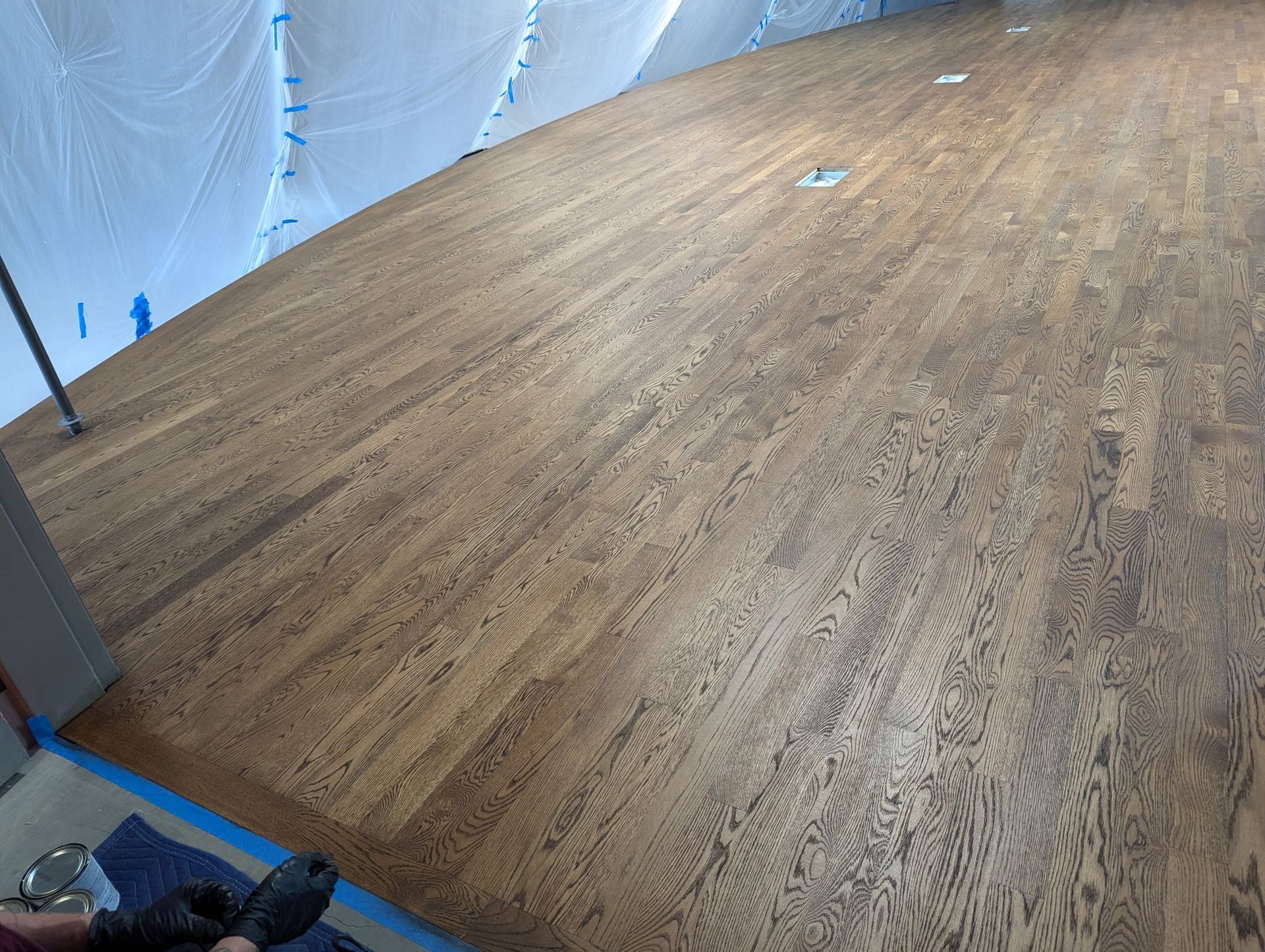 Wooden floor being refinished.