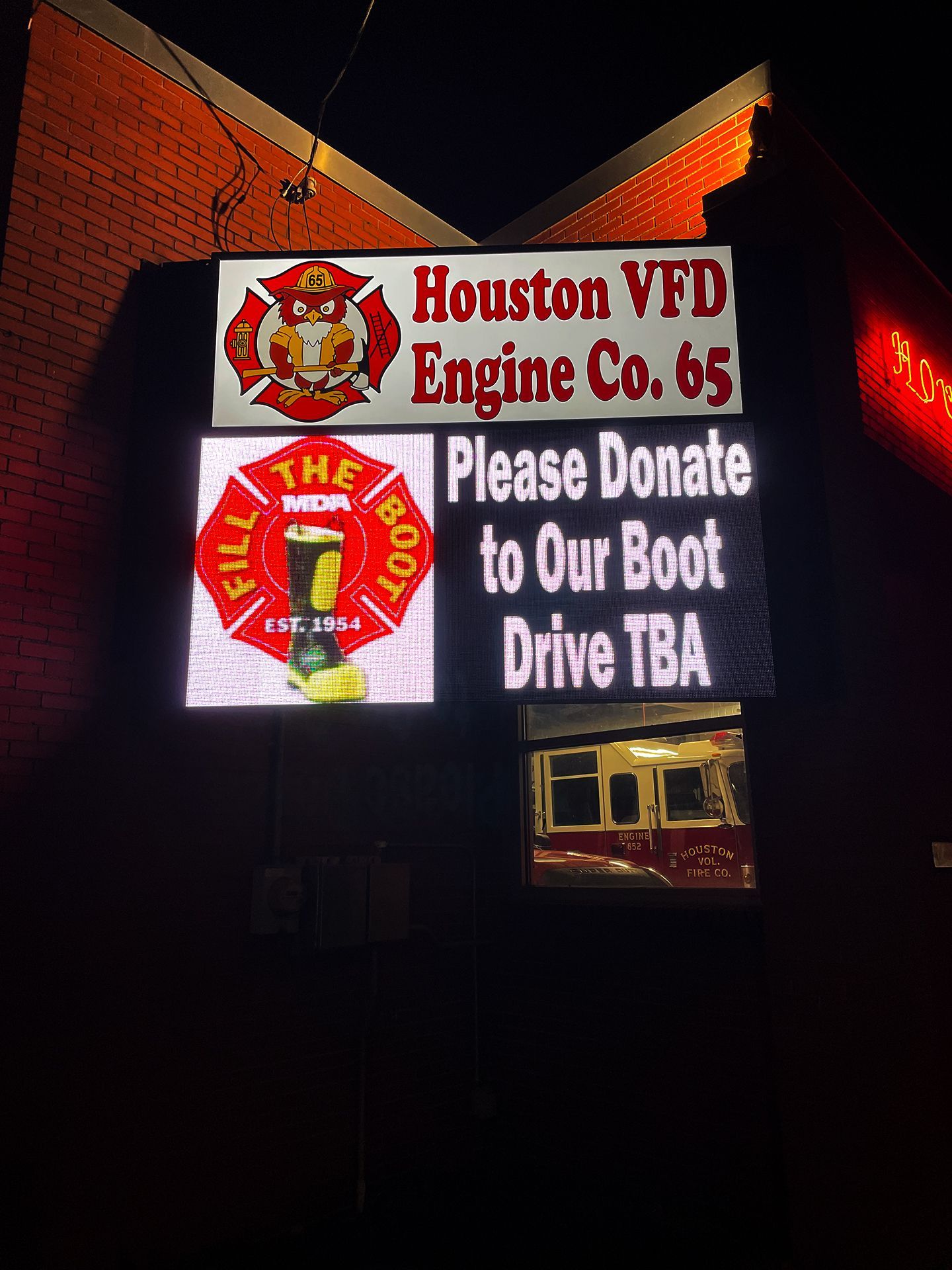 LED sign that says Please Donate to Our Boot
