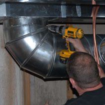 man working on duct
