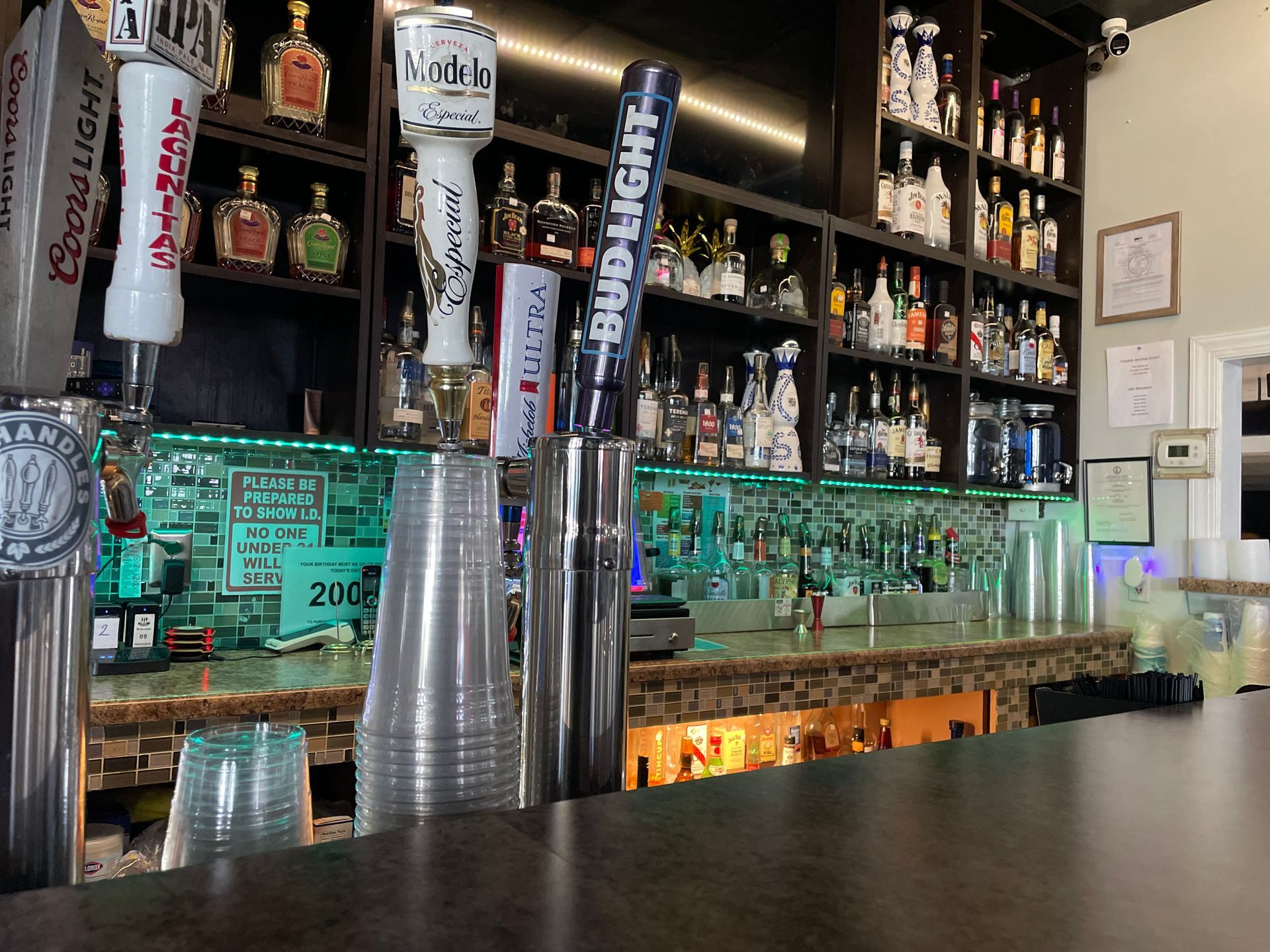 A bar with a bunch of beer taps on it