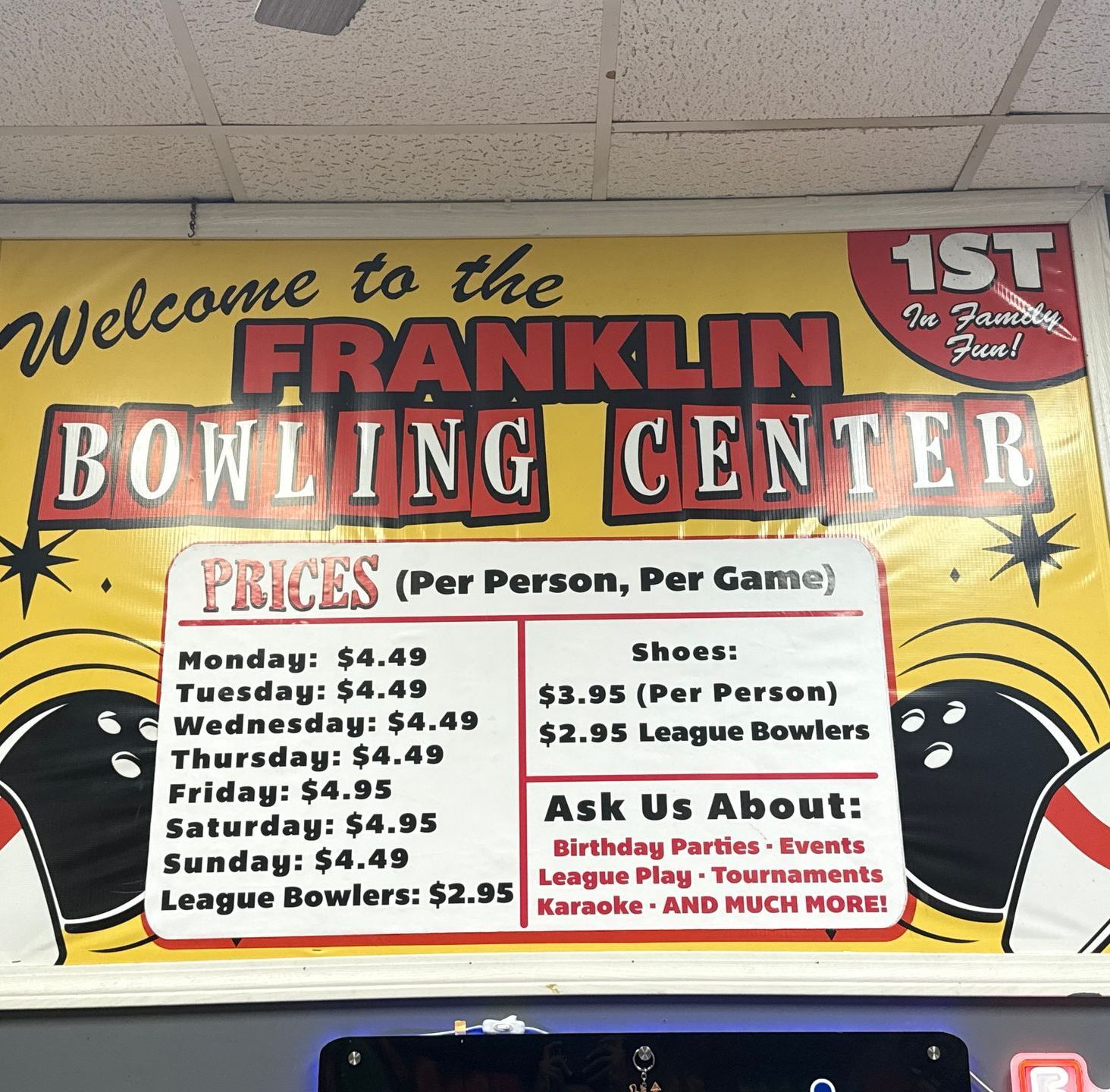 Sign for Franklin Bowling Center with price list, including bowling prices and offers for birthday parties, events, and karaoke.