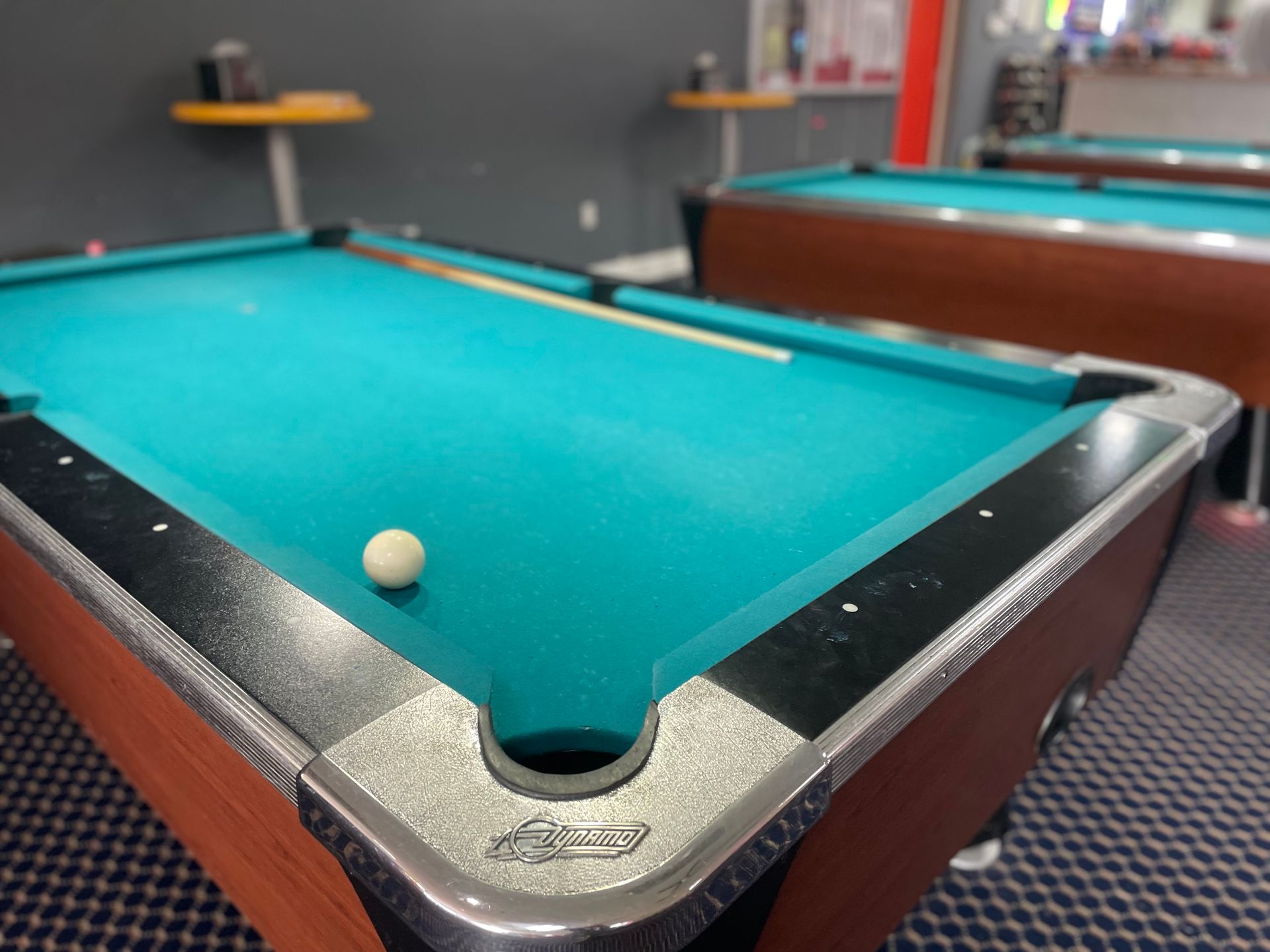 A pool table with a ball in the hole
