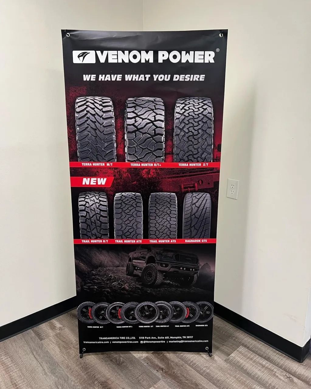 Venom Power tire display banner in a corner, showing multiple tire models and a red “NEW” strip