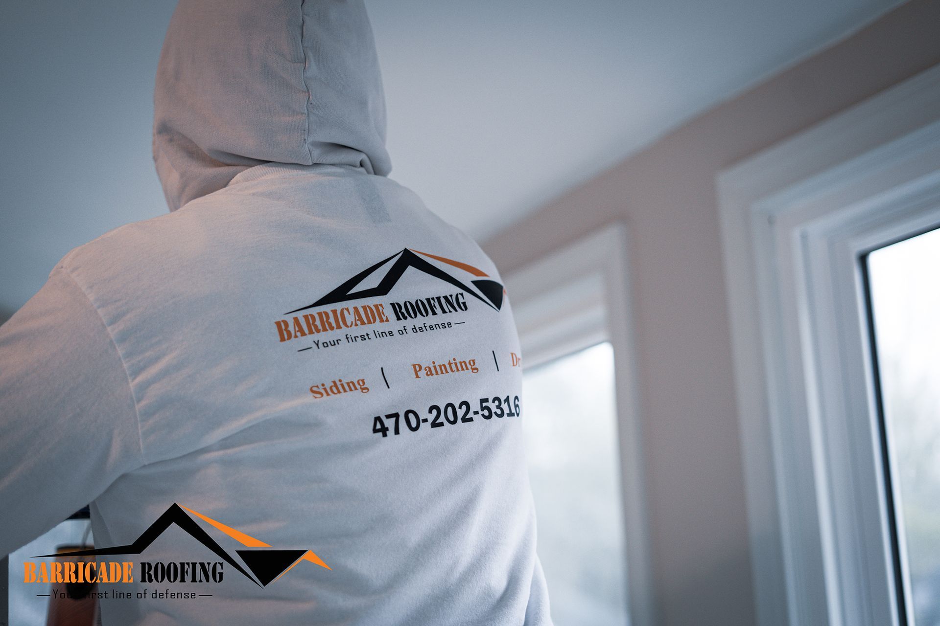 Person wearing a white hooded shirt with 