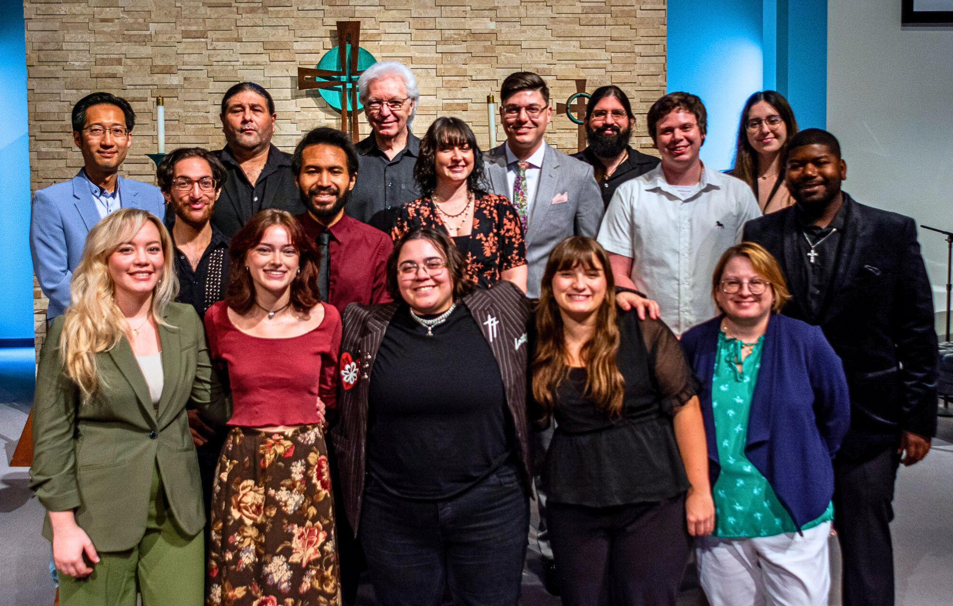A group of people are posing for a picture in a church.