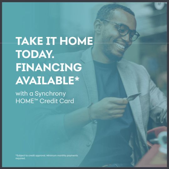 Man smiling, holding card. Text: 'Take it home today. Financing available' with a Synchrony HOME credit card logo.