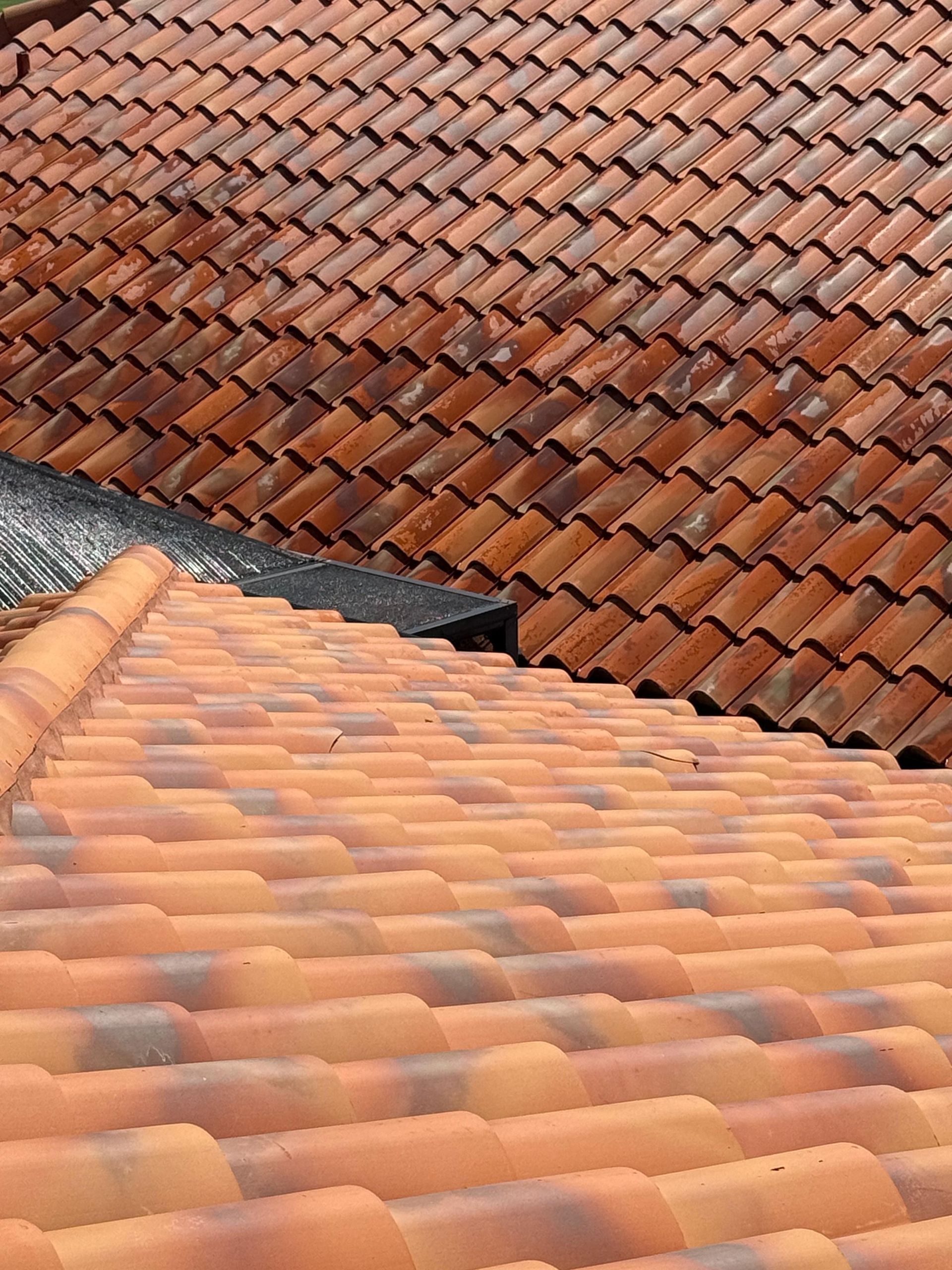 Terracotta-tiled rooftops with overlapping orange clay tiles