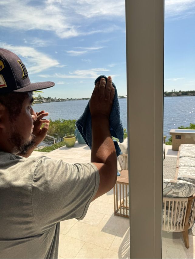Professional window cleaning with waterfront view